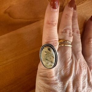 Elegant Silver and Cream Stone Ring. Currently set at size 7.5 but it’s sdj